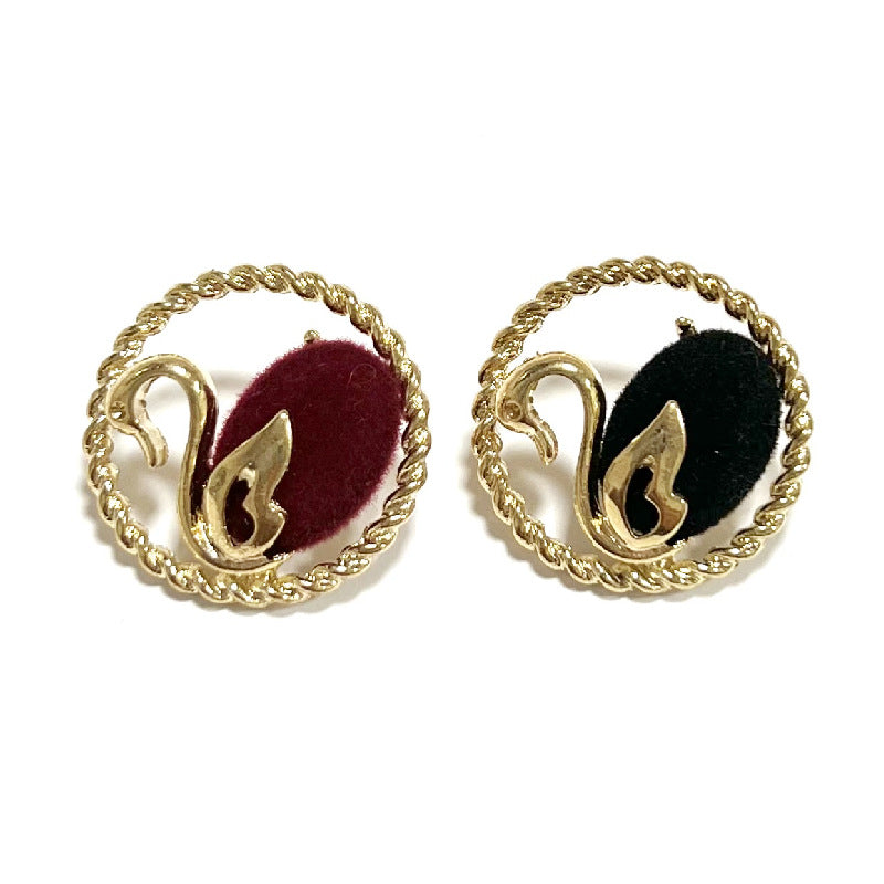 Swan flocked metal shank buttons, gold edge; black and red variants shown