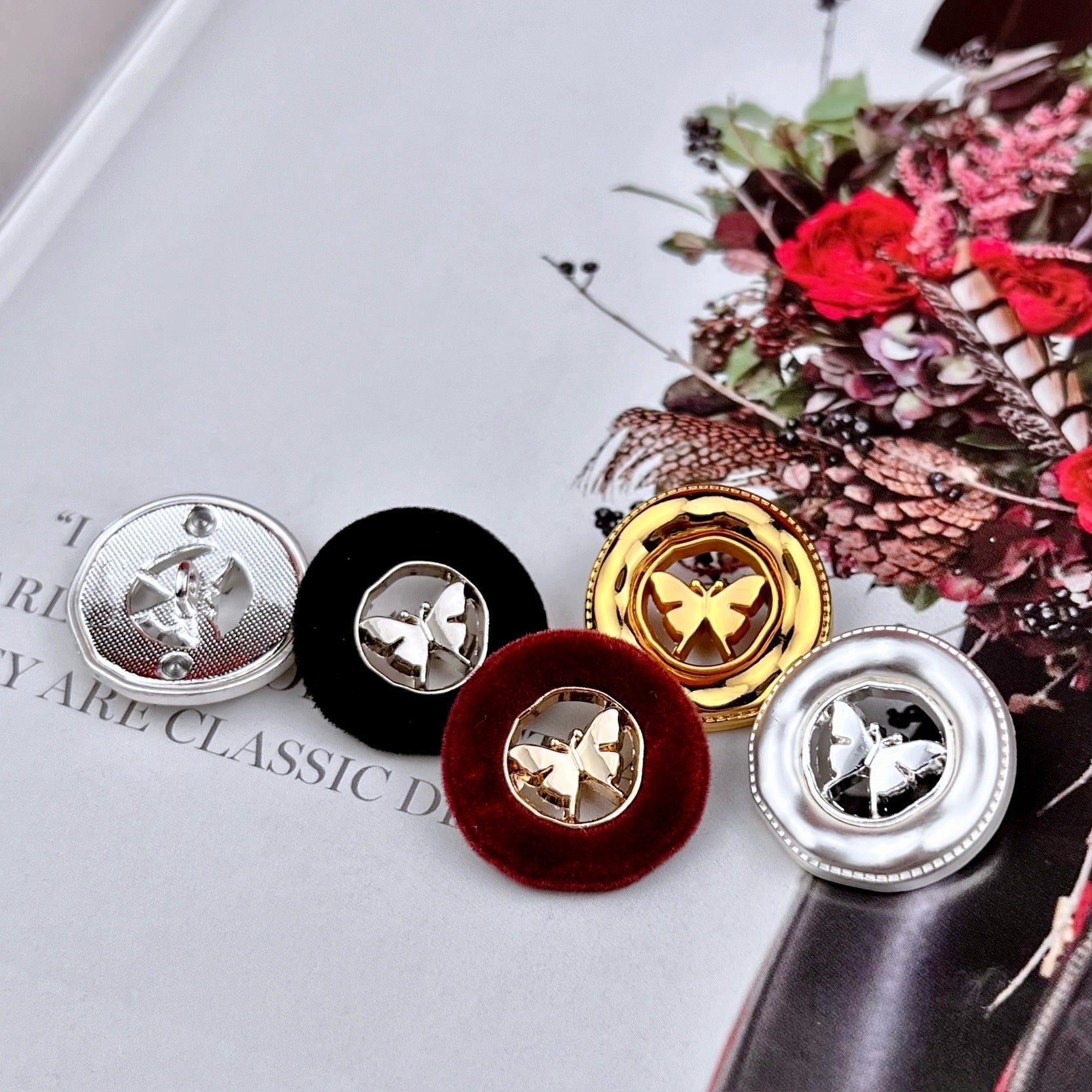 Assorted butterfly metal buttons with flocked velvet backs in silver, black, burgundy, gold