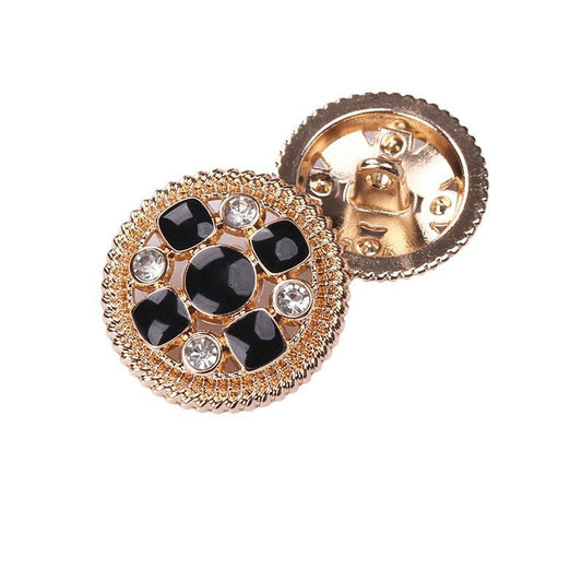 Round crystal shank button: black enamel discs, gold-tone bezel, rhinestone accents