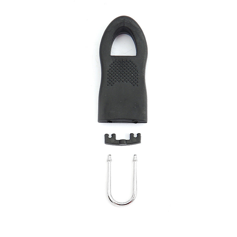 Black detachable zipper pull with perforated grip and U-shaped metal bolt, replacement part