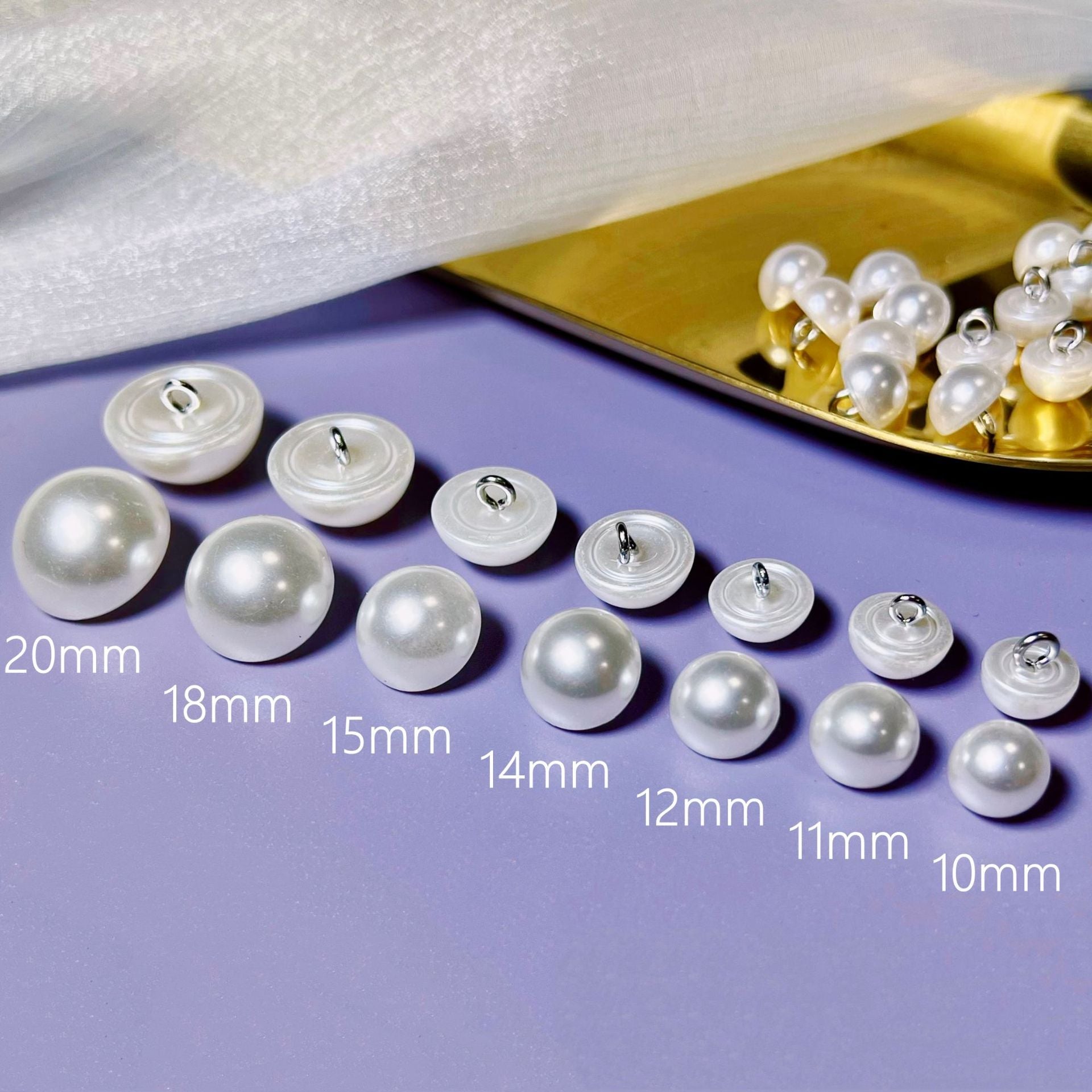 Set of plastic mushroom buttons in pearl-silver, 10mm–20mm sizes shown