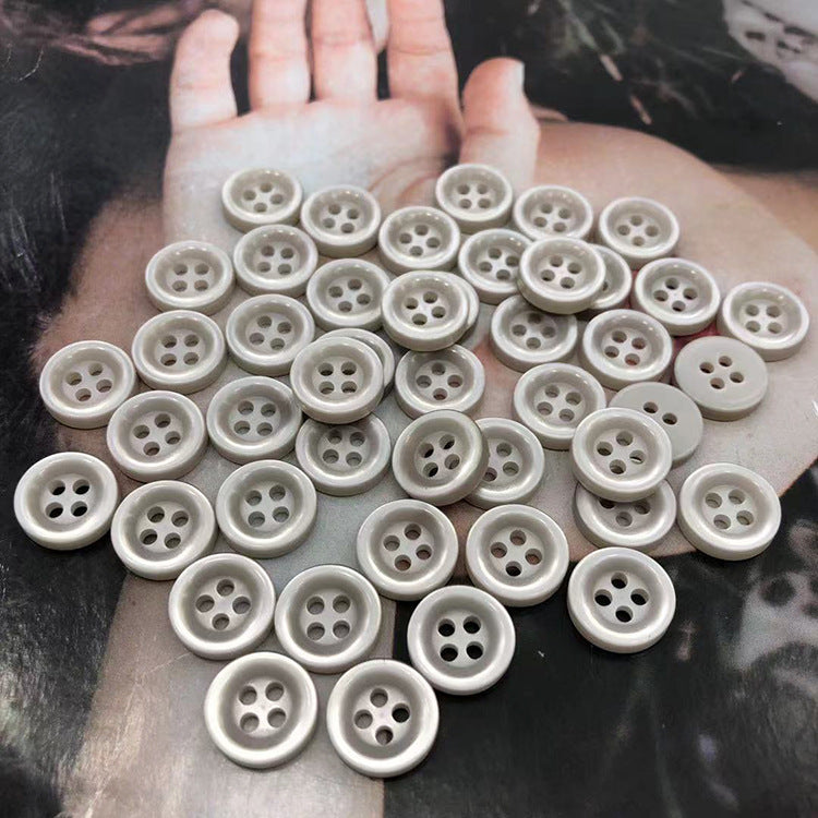 Round resin shirt buttons, 4-hole, light cream/ivory grey, many fronts spread out