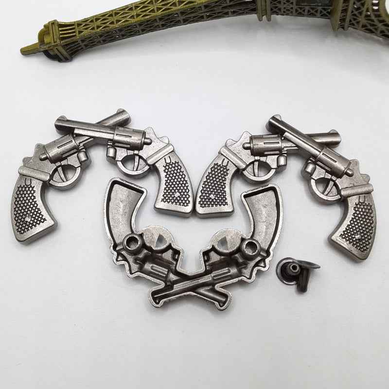 Antique silver double gun rivet studs, two-piece pistol wreath design