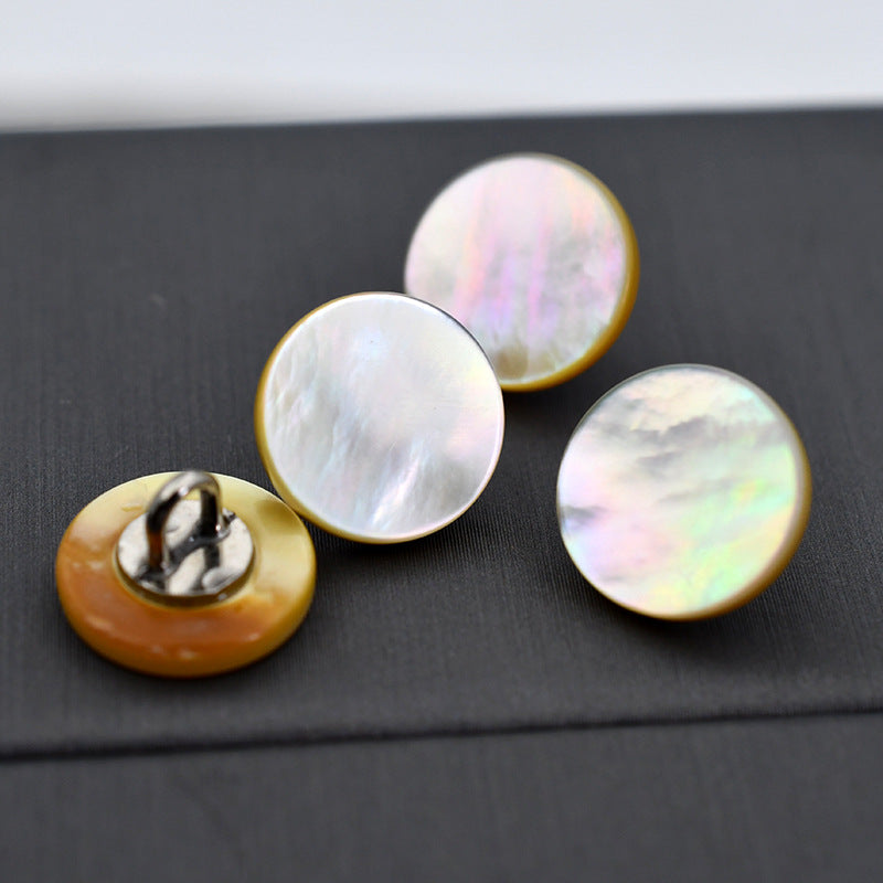 Natural round shell buttons with metal shank, iridescent white and tan.