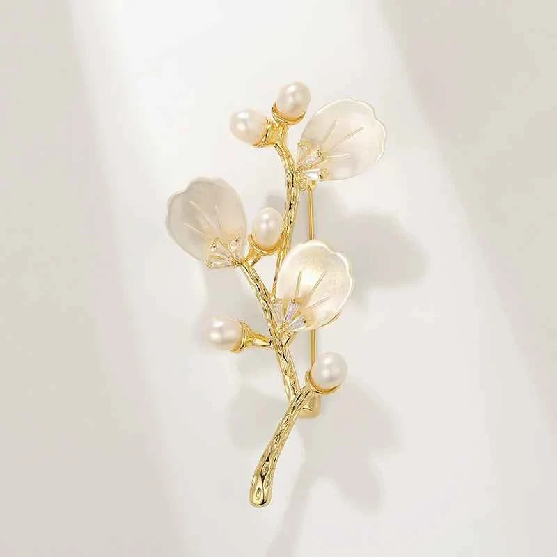 Gold-tone branch brooch with mother-of-pearl shell flowers and freshwater pearls