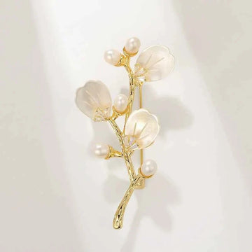 Gold-tone branch brooch with mother-of-pearl shell flowers and freshwater pearls