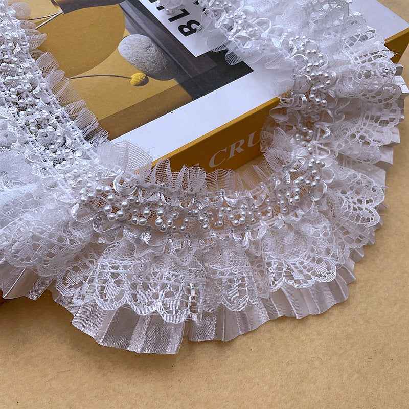White lace ruffle trim edging with dense pearl bead row and scalloped lace pattern