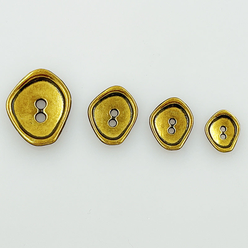 Gold-tone irregular 2-hole metal buttons, four sizes with darker outer rim detail