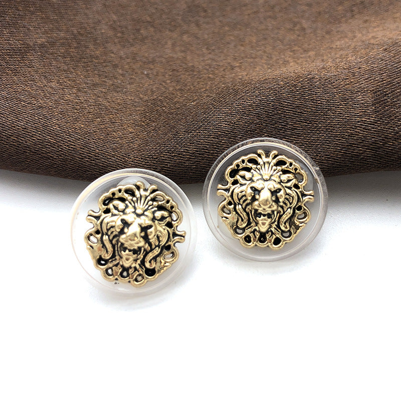 Round 18mm transparent-edge lion head metal shank buttons, dark gold detail (pair shown)