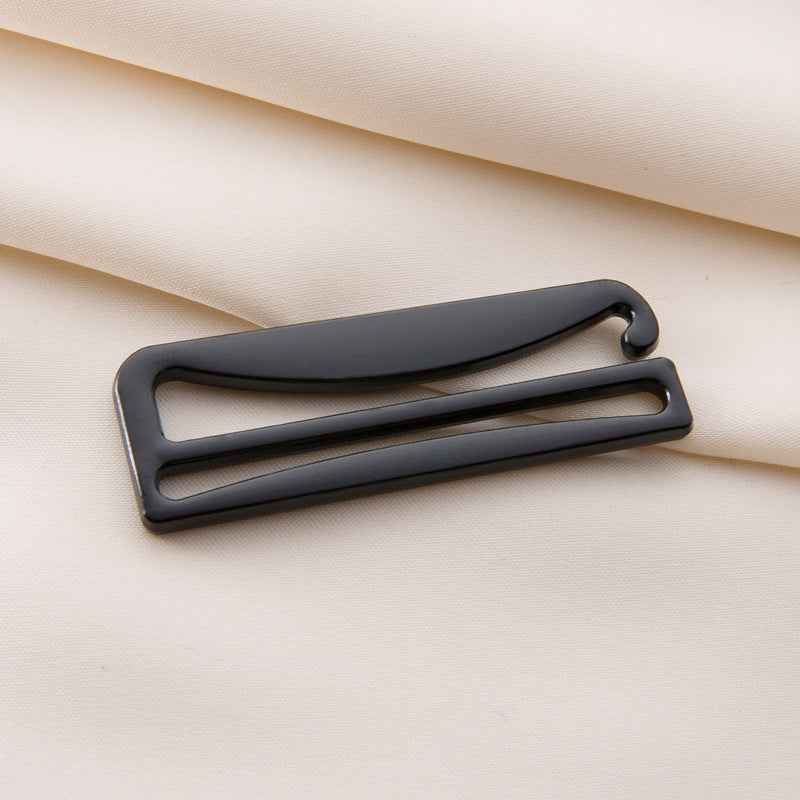 Bra strap adjuster with dark frame and sliding bar, curved hook detail