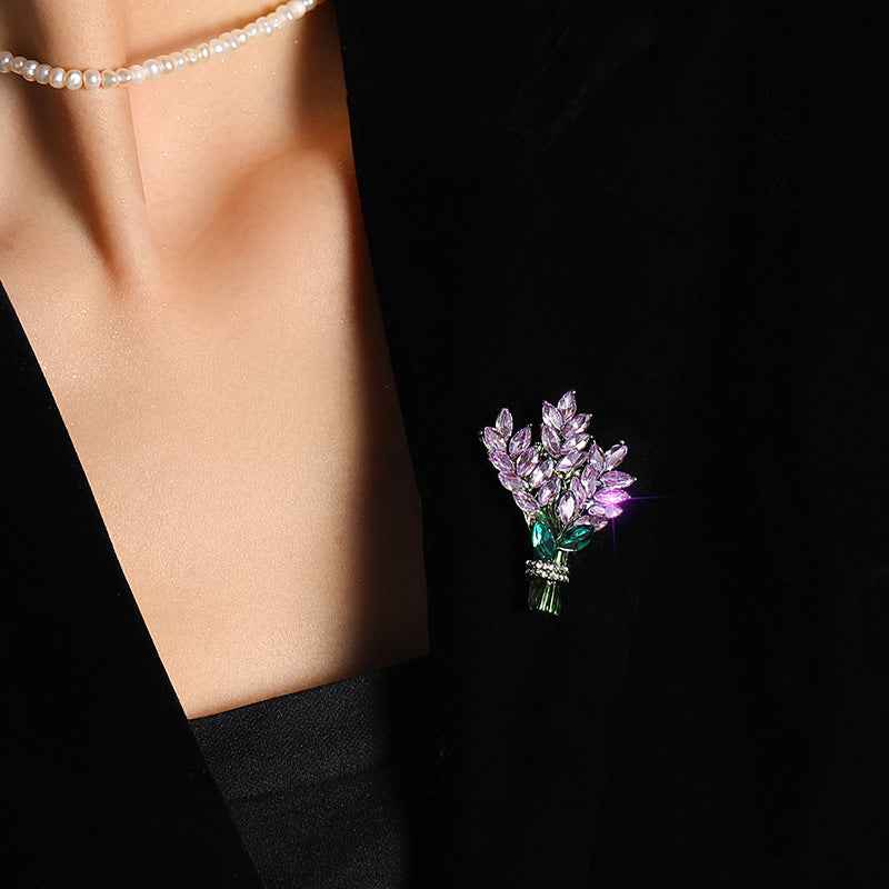 Lavender crystal bouquet brooch pin with teal leaf and pavé centerpiece