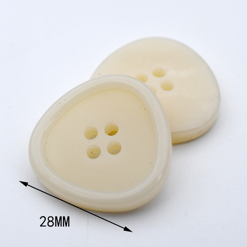 Round beige resin button fronts with 4 holes; underside visible; size 28mm