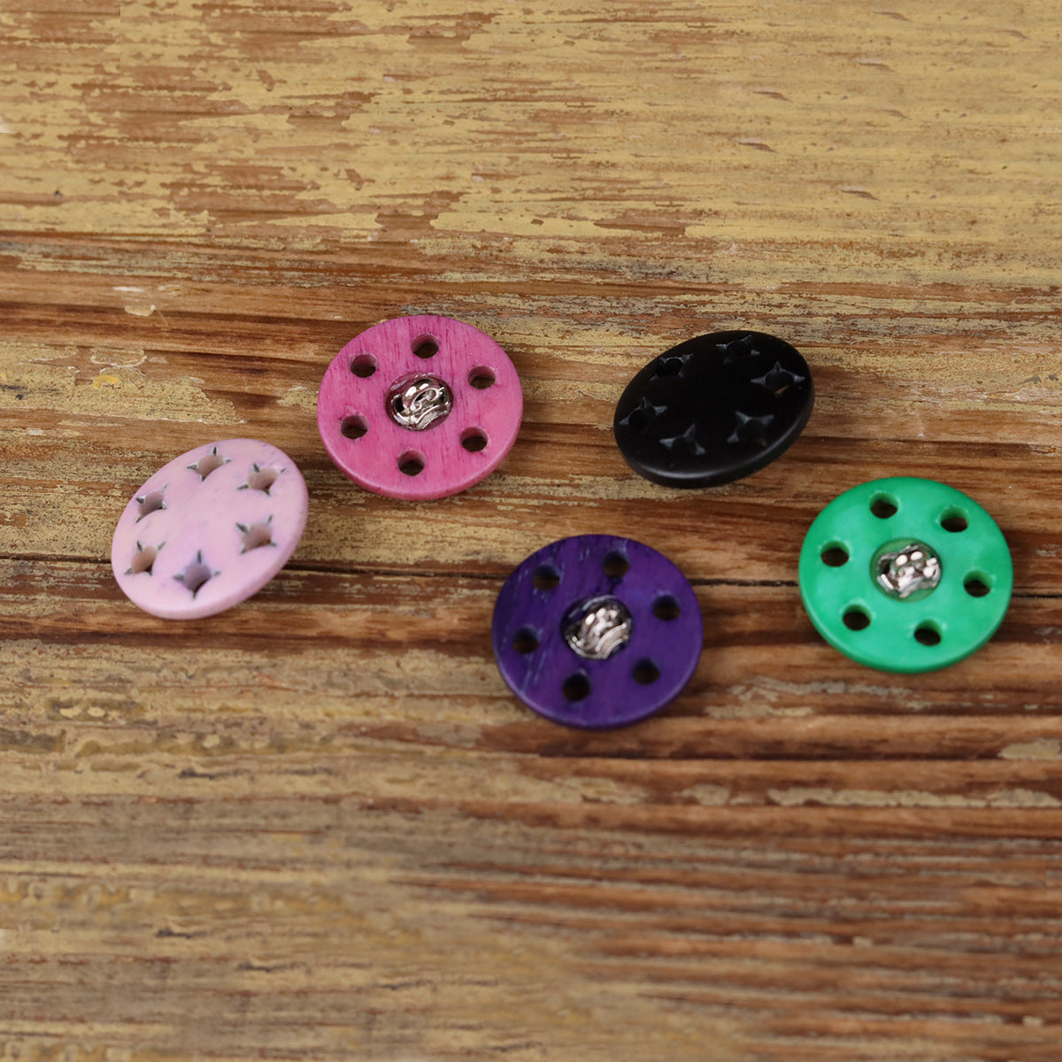 Star-cutout horn shank buttons with metal shanks: pink, purple, black, and green