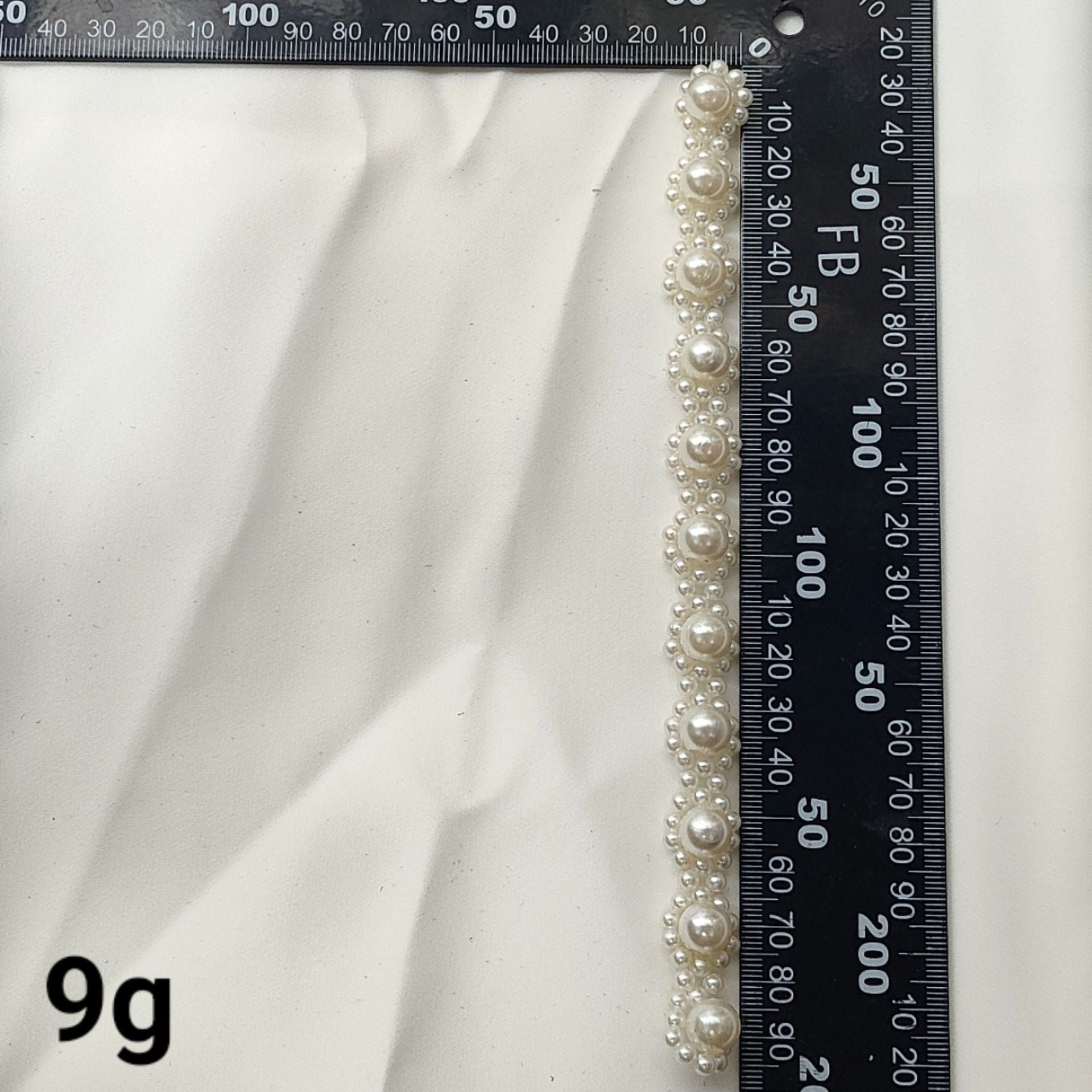 Long pearl flower stripe patch with round pearl accents along the length