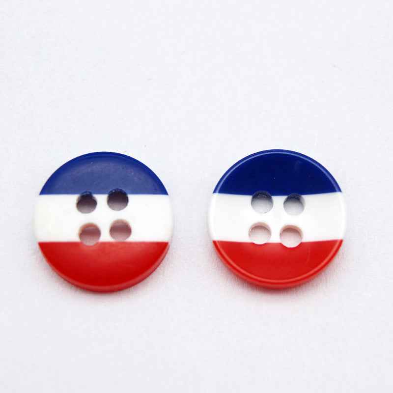 Round resin button with navy, white, and red horizontal stripes; four holes.