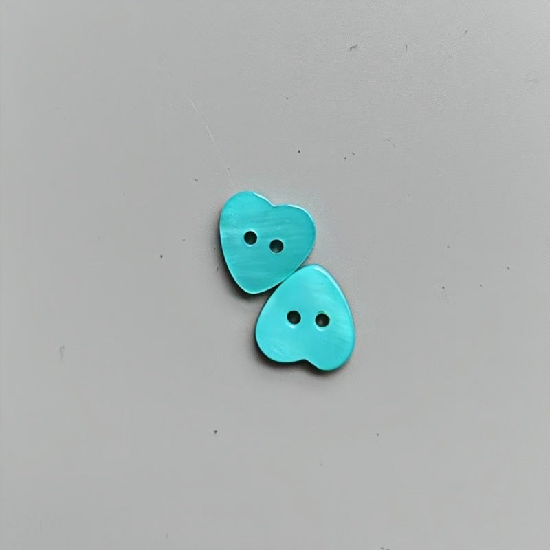 Blue heart-shaped 2-hole shirt buttons for children, two buttons shown.