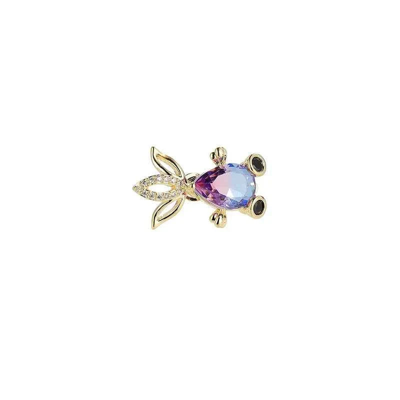 Goldfish zircon brooch pin with oval blue-purple crystal and gold-tone details