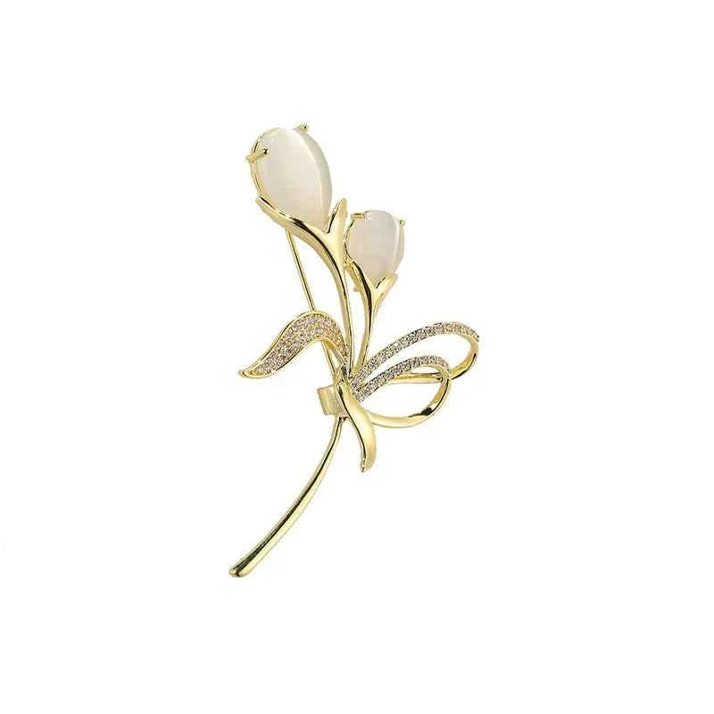 Tulip brooch with beige cat’s-eye stone and gold-tone design