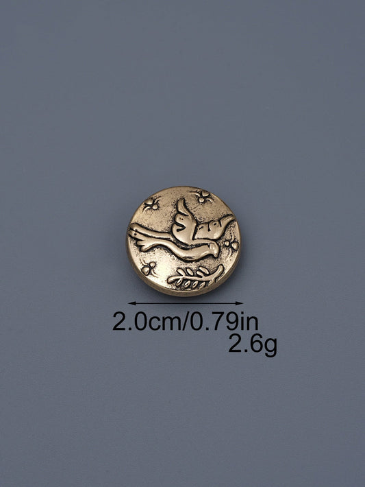 Gold-toned embossed metal shank button with flying bird design, ~2.0cm