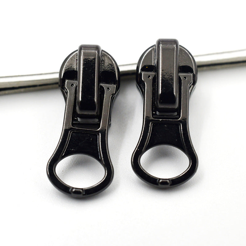 Two heavy-duty metal zipper pulls (#4) in black finish, round ring grip tab