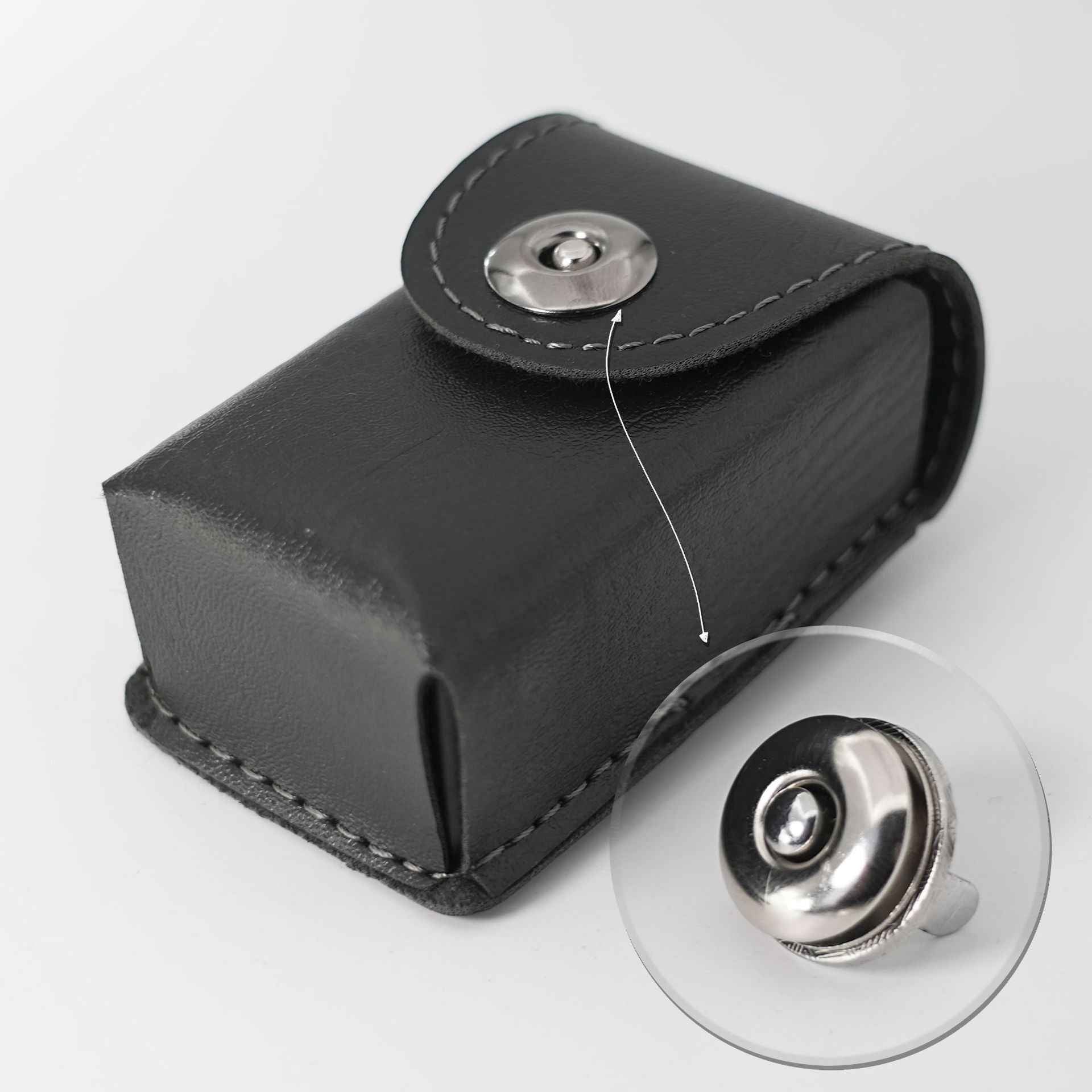 Black leather-style flap with silver magnetic snap closure and round button top