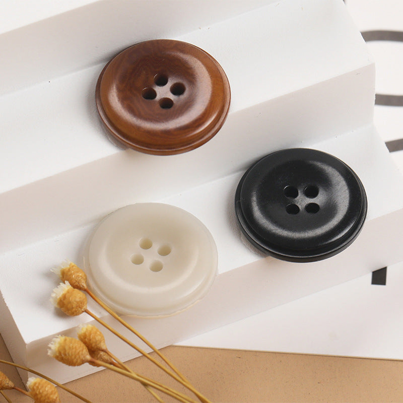 Natural fruit shell 4-hole round buttons in dark brown and black, with off-white