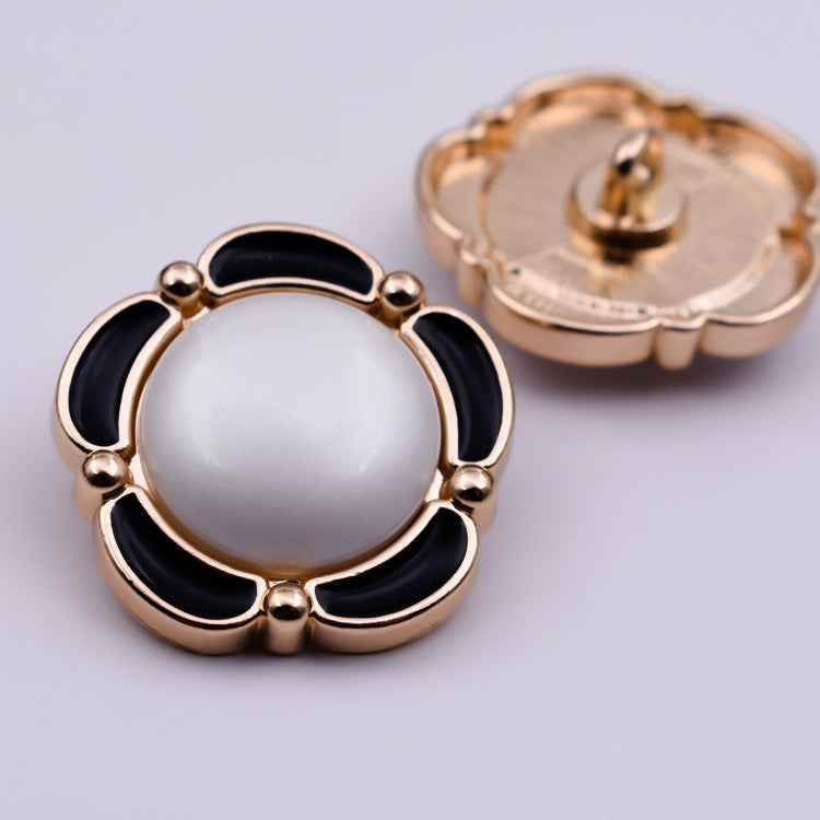 Round shank buttons with floral lace look, black enamel panels, gold tone