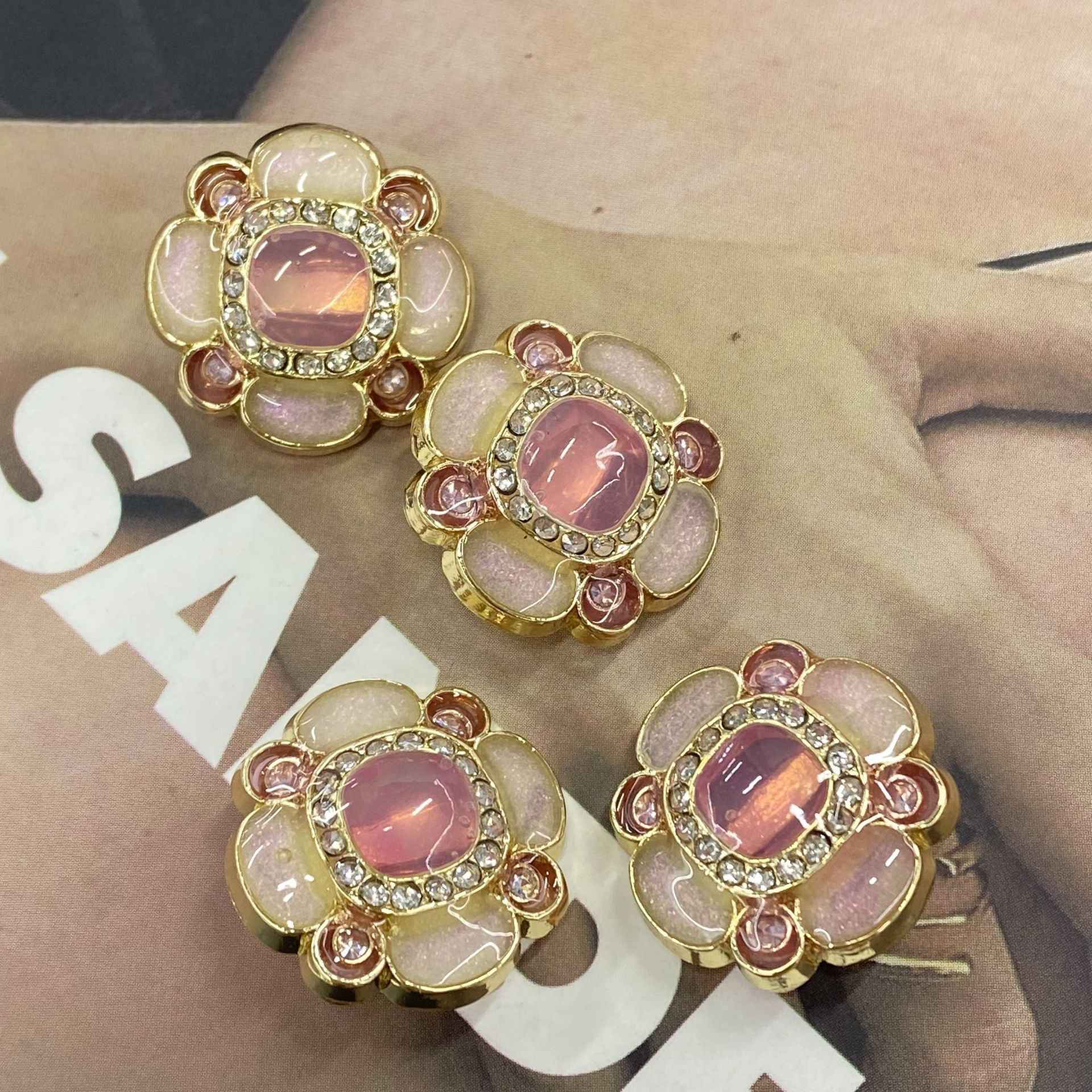 Jelly flower metal shank buttons, pink oval center with gold-tone scalloped petals