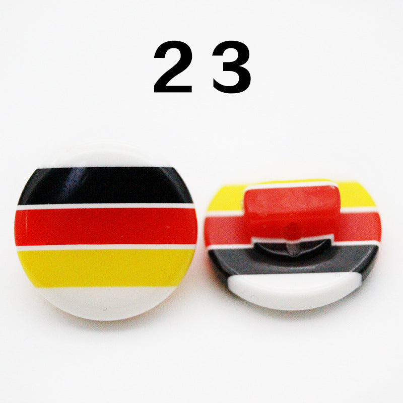 Resin button with horizontal stripes, black, red, and yellow banding, round shank