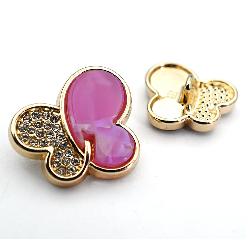 Purple butterfly rhinestone shank button with gold-tone metal shank