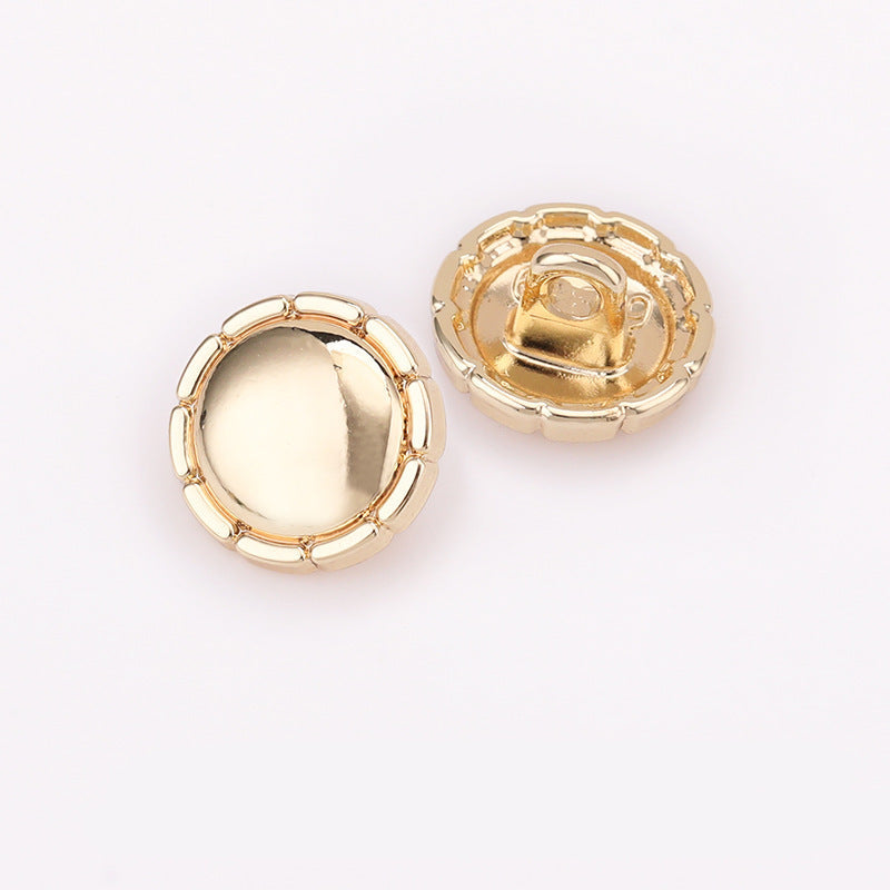 Front view domed round metal shirt buttons in light gold and gold tones