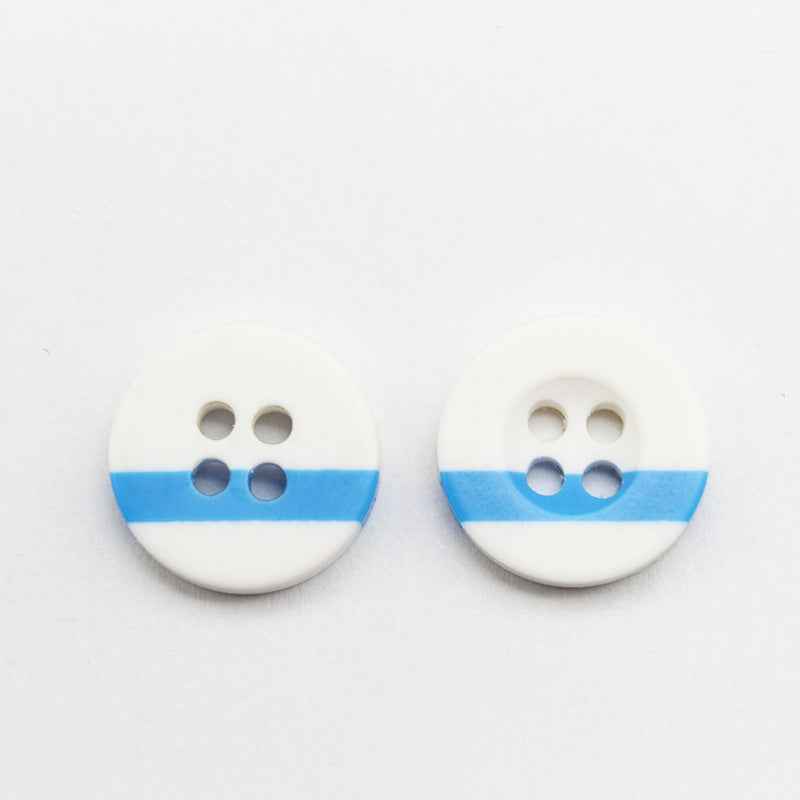 White resin button pair with four holes and blue stripe across the front
