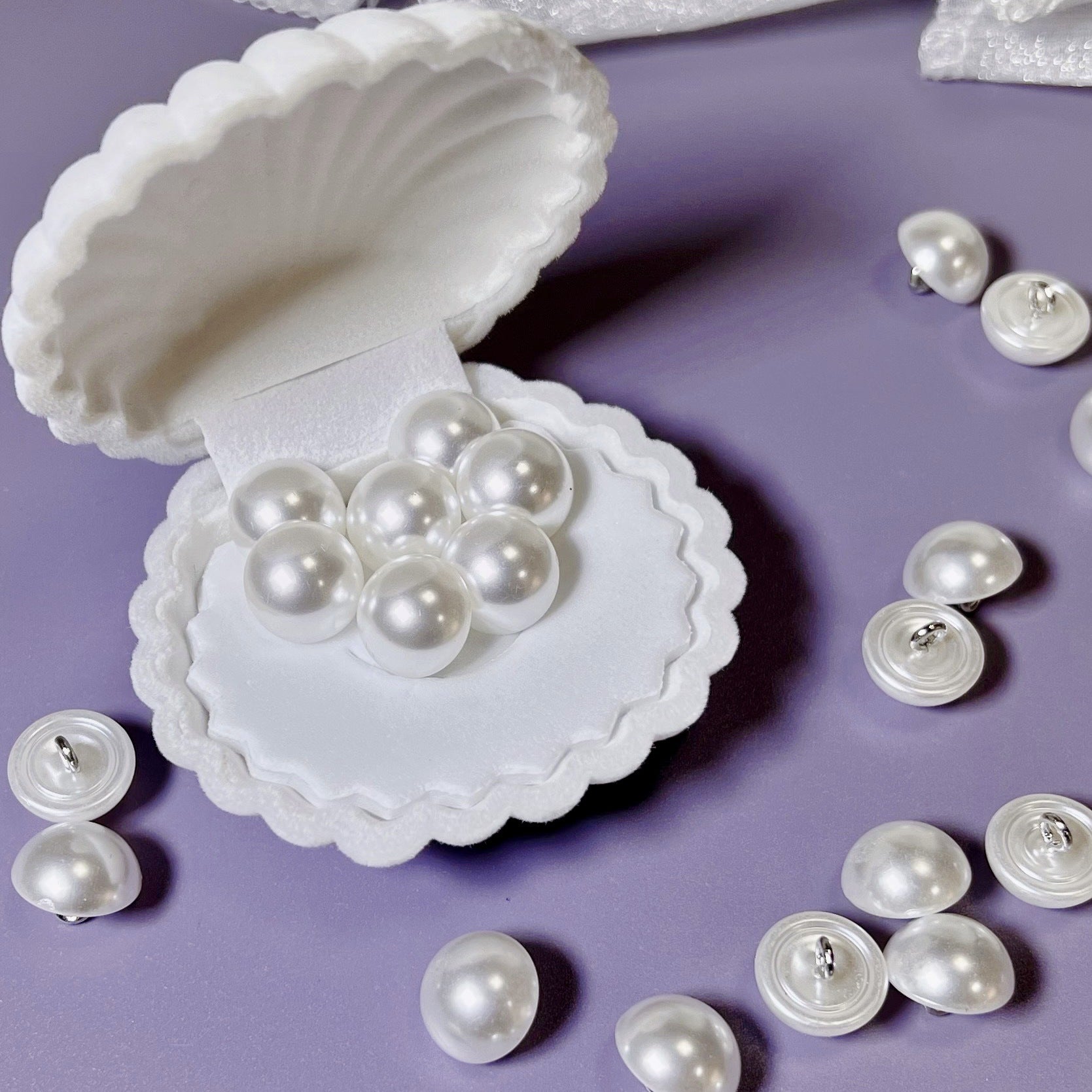 Pearl-silver plastic mushroom buttons with visible shank, assorted sizes pack