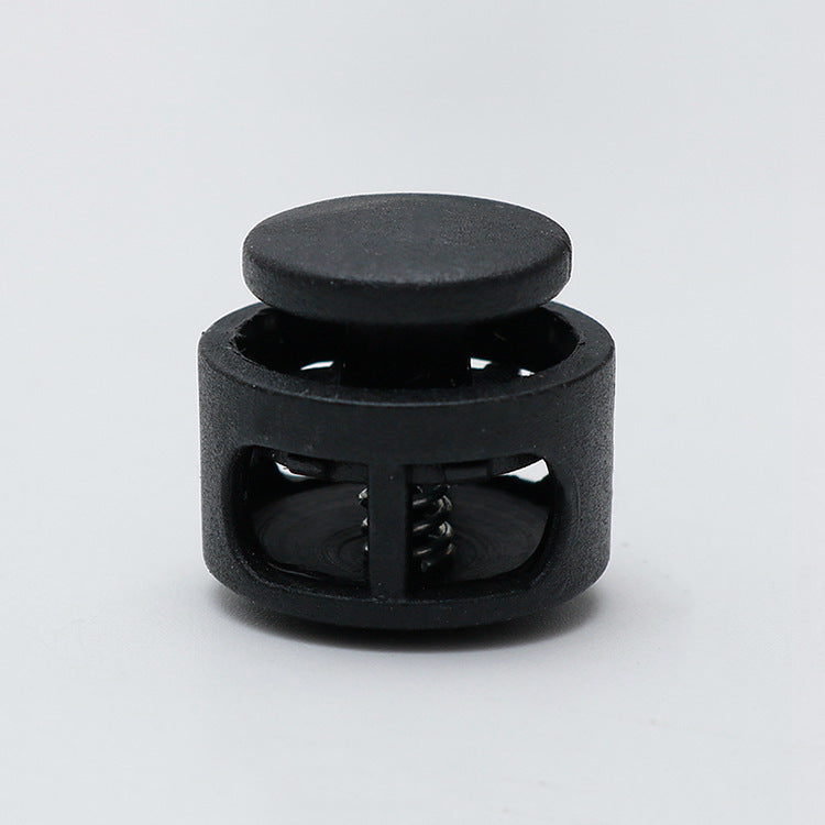 Black 17mm plastic cord lock toggle with spring stopper, enclosed housing