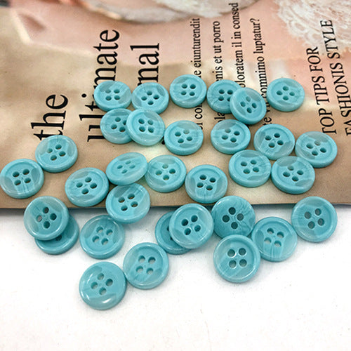 Turquoise round 4-hole shirt buttons, multiple button faces with four holes