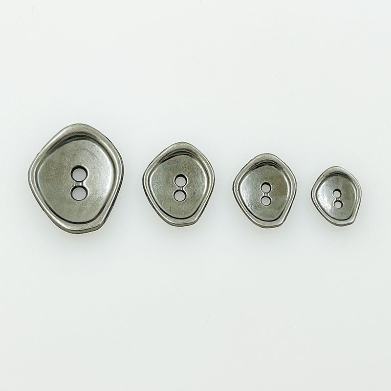 Irregular 2-hole metal buttons in silver tones, four sizes with raised border detail