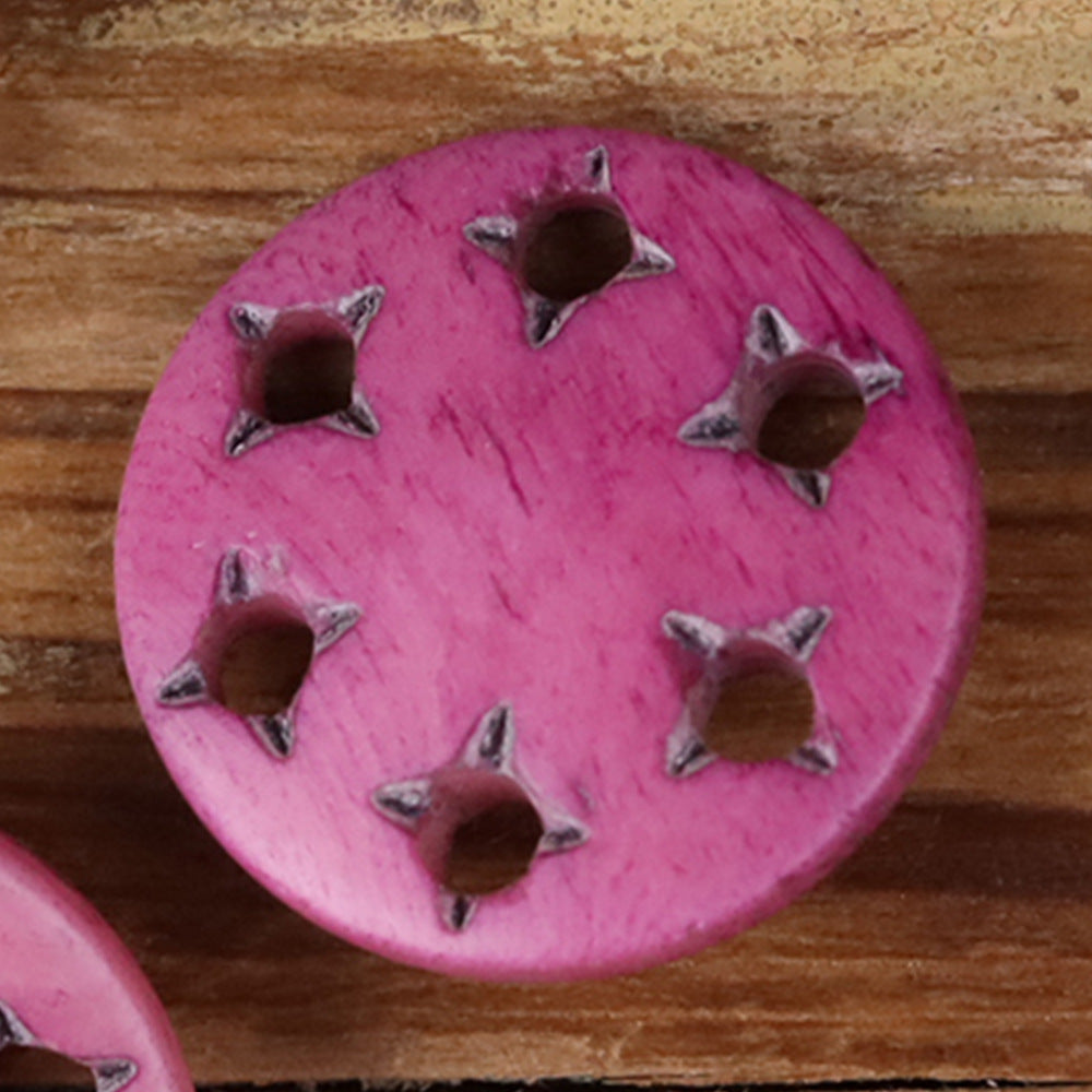 Pink star-cutout horn shank button with metal shank and star-shaped cutouts
