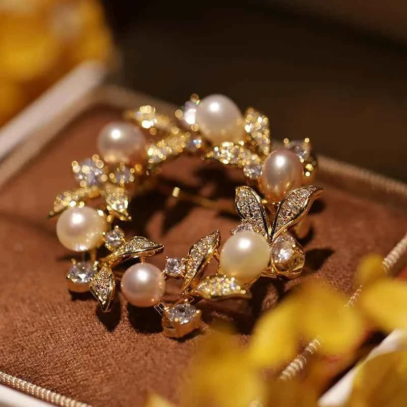 Pearl and rhinestone wreath brooch pin, round pearls with gold-tone leaf detailing