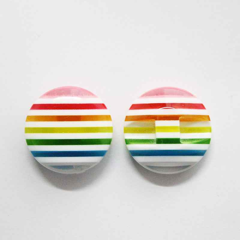 Colorful striped resin buttons with pink translucent top and horizontal rainbow stripes