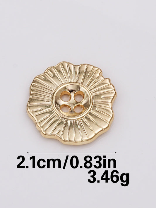 Gold 21mm decorative 4-hole metal button with raised radial sunburst pattern