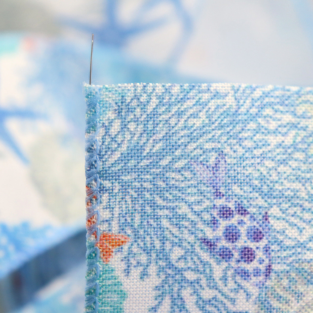 Close-up of blue coral reef grosgrain ribbon weave and printed starfish, wire edge