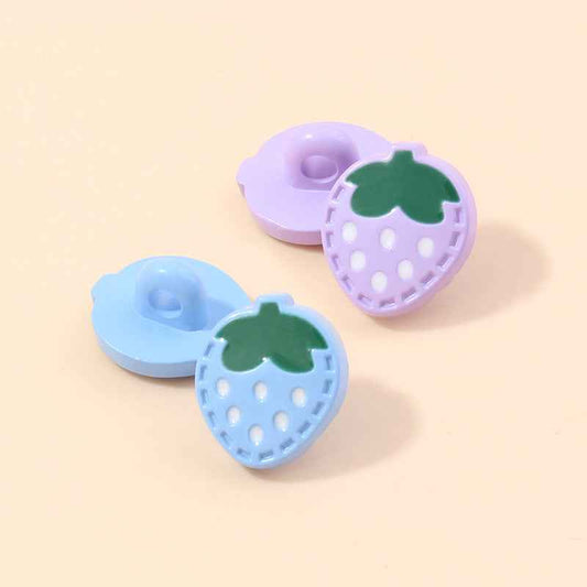 Light purple strawberry-shaped plastic shank button with green leaf and white dots