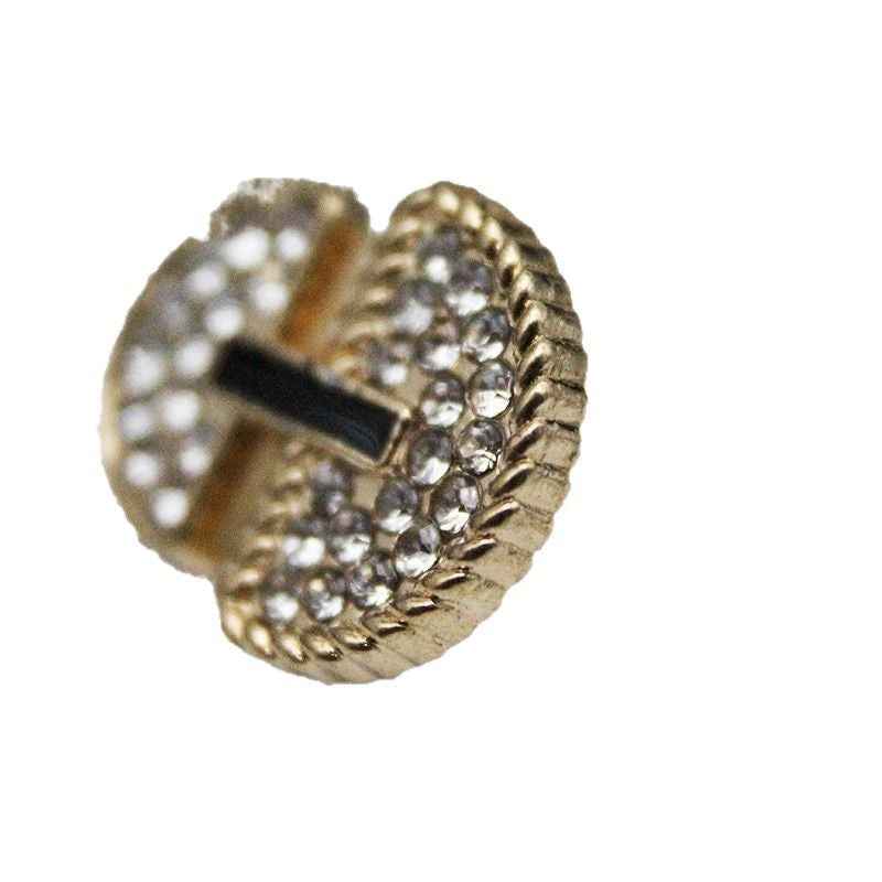 Gold umbrella-shaped rhinestone metal shank button, close-up side view