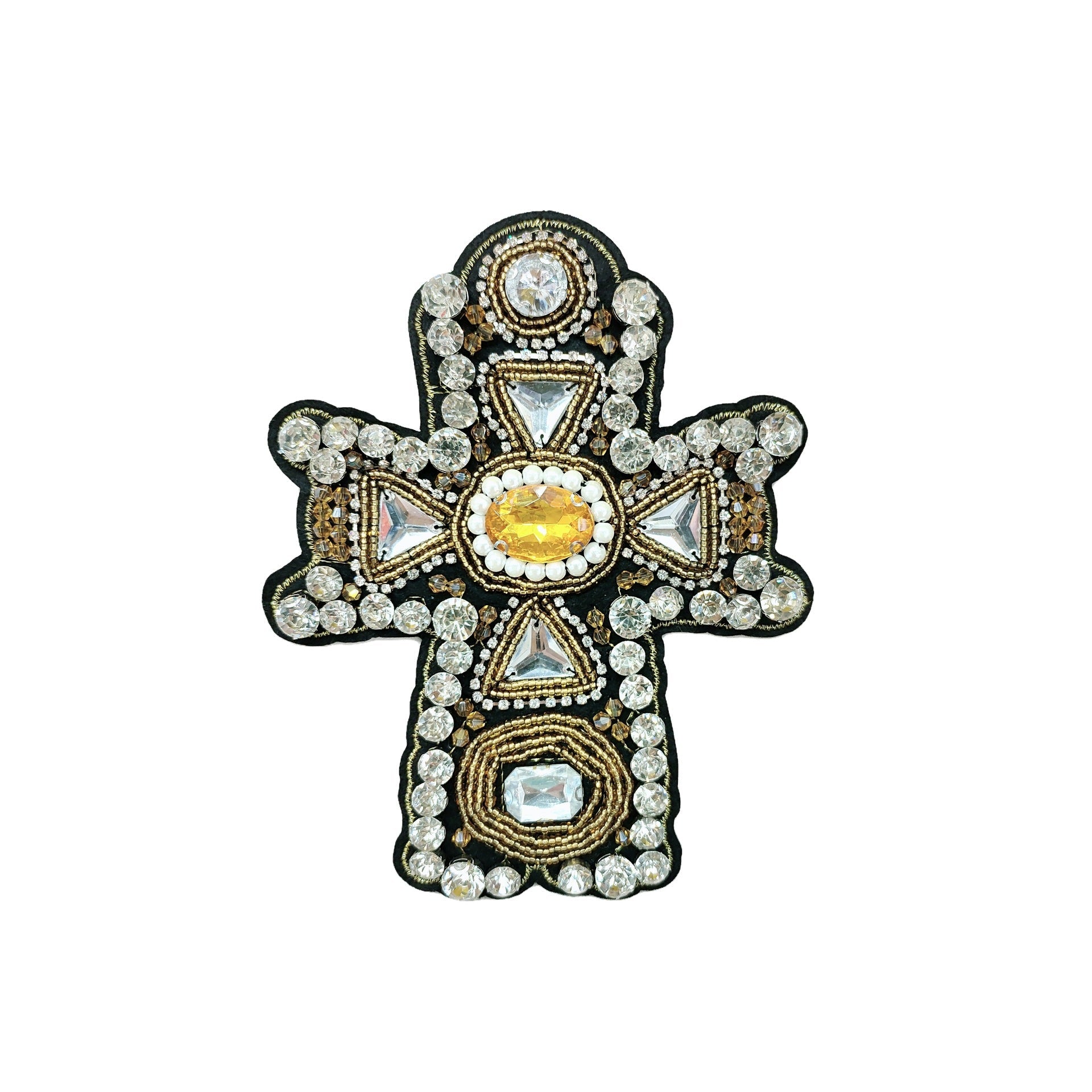 Black cross appliqué with gold-tone beading and a yellow center crystal