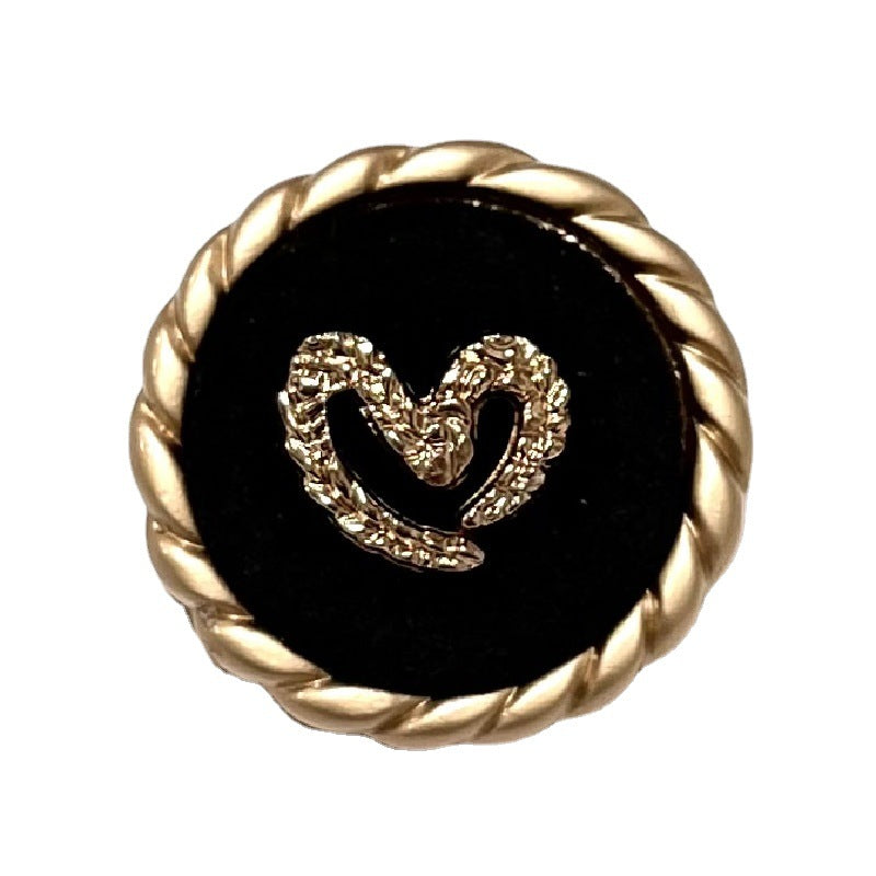 Round black flocked sewing button, gold rim, heart pattern center, 25mm