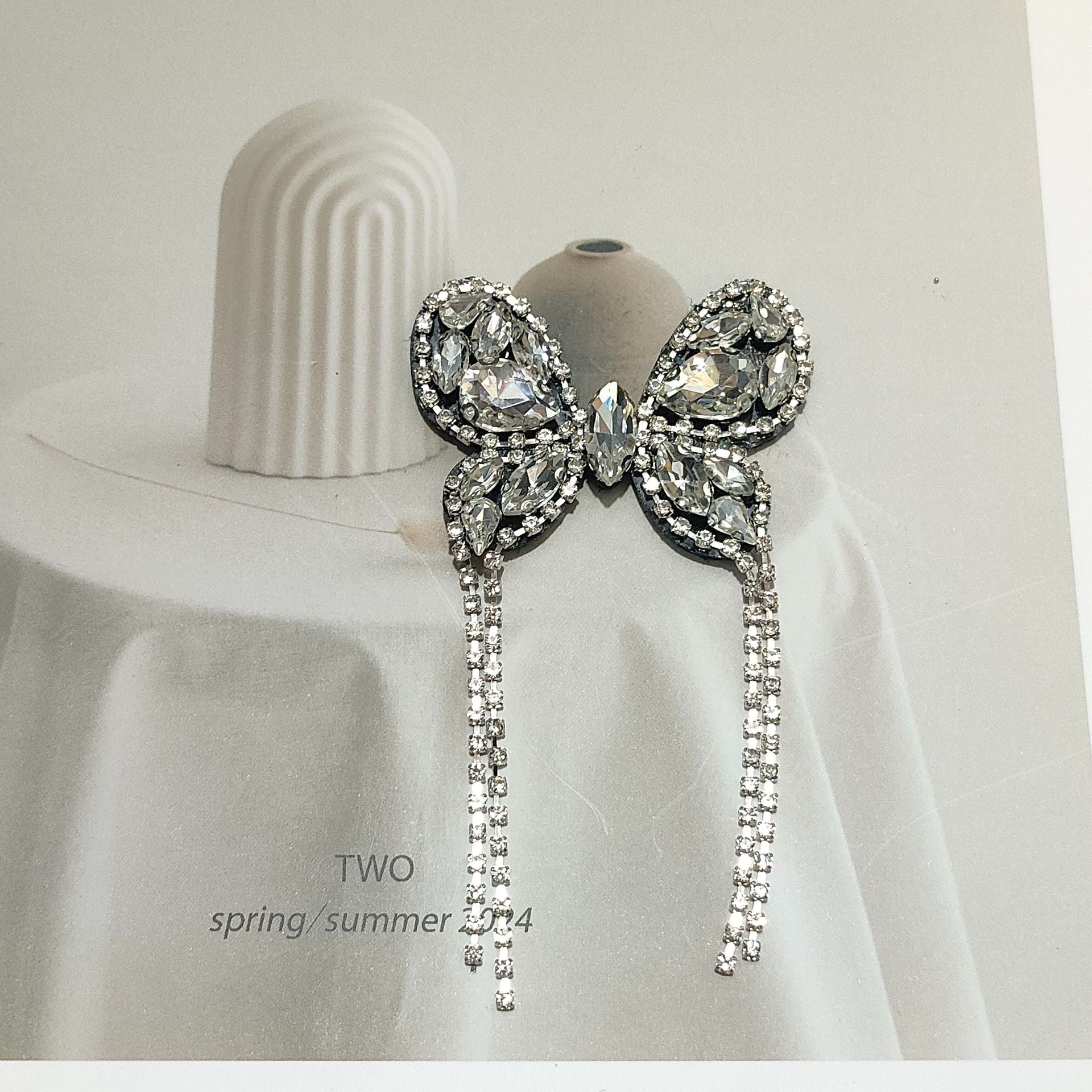 Rhinestone butterfly shoe clip with layered crystal wings and long hanging chains