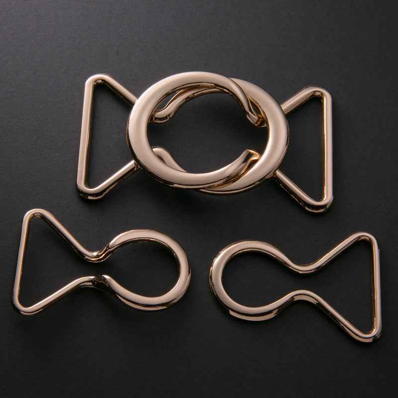 Coat belt buckle with ring clasp—mixed silver and gold metal pieces