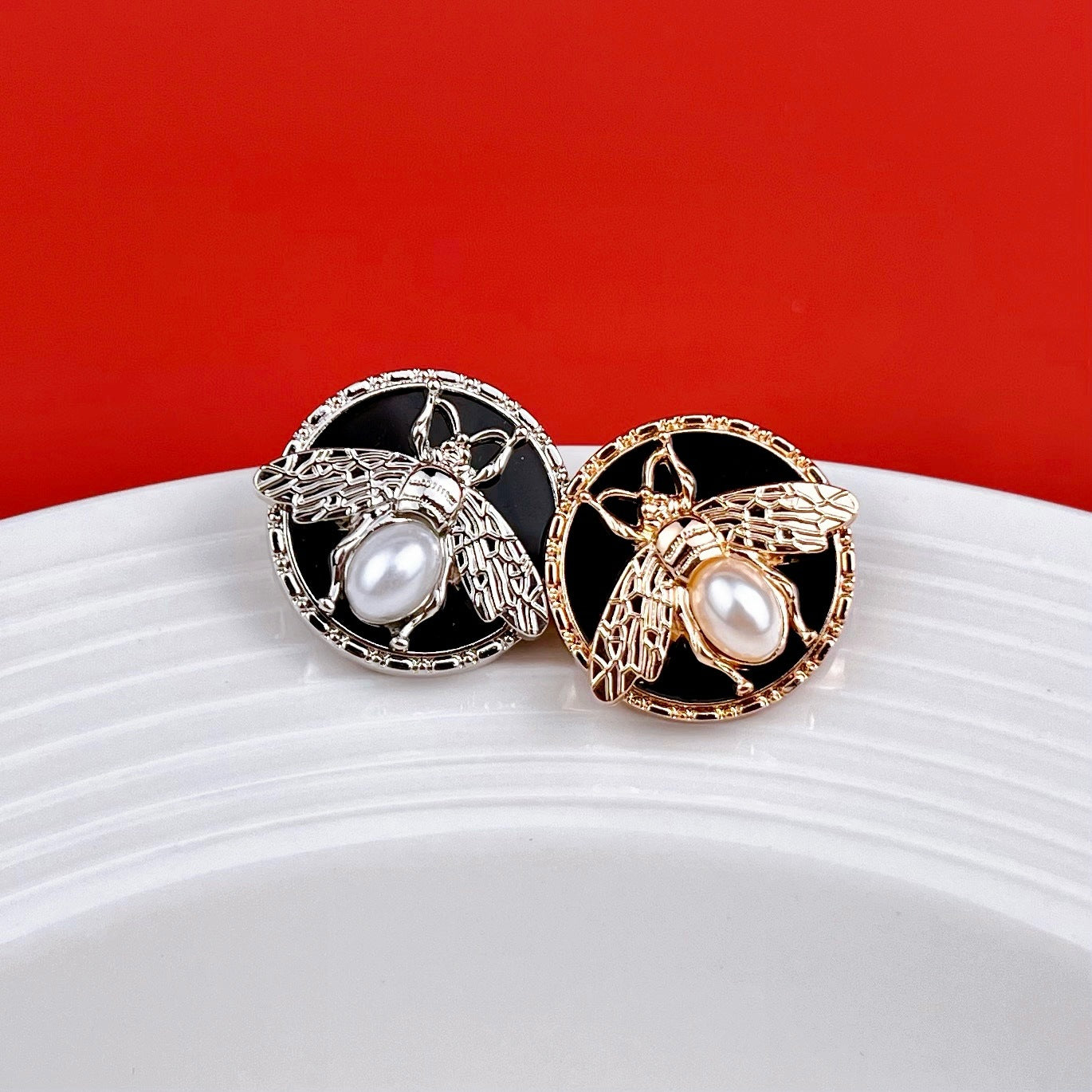 Round bee pearl metal shank buttons, silver and gold, pearl-like center on black