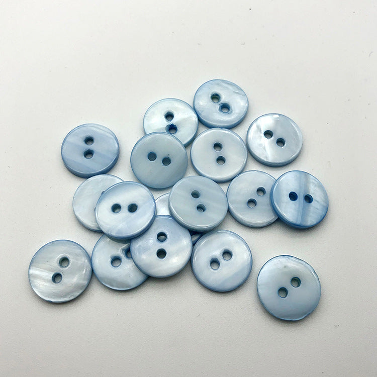 Sky blue round two-hole flat shirt buttons, 12.5mm, close-up (20 pcs)