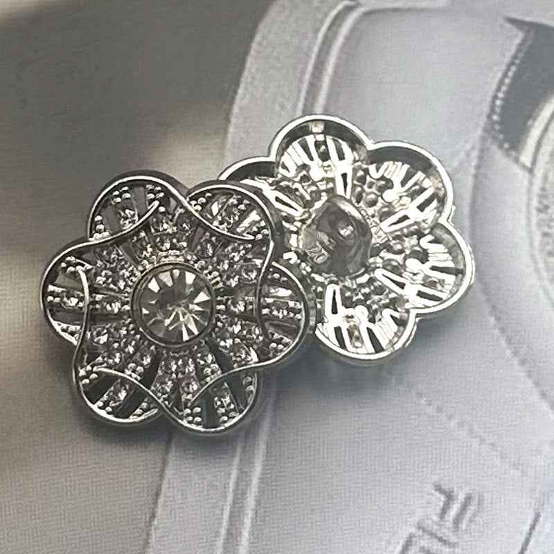 Floral crystal coat buttons, silver-toned with central rhinestone and gold accent back